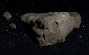 Asteroid de culoare inchisa prin spatiu interstelar